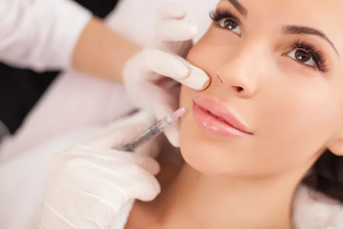 A woman receiving a facial injection