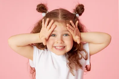 A child smiling in the waiting room