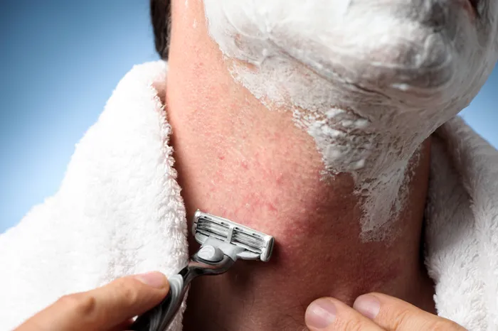 A man shaving his face